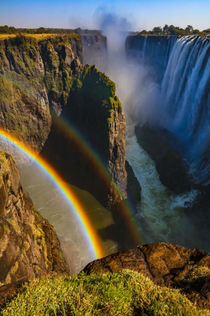Majestic Victoria Falls Wallpaper with Vibrant Double Rainbow