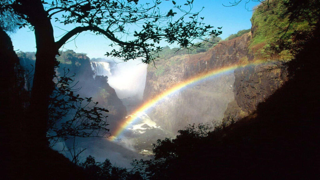 Stunning Wallpaper: Victoria Falls with Rainbow & Lush Greenery