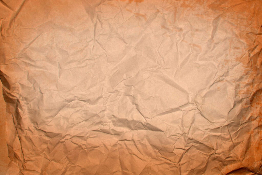 Vintage Elegance: Captivating Brown Crumpled Paper Wallpaper