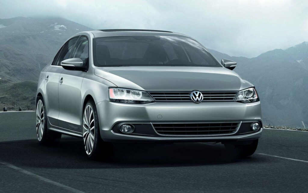 Sleek Volkswagen Jetta Wallpaper: Stylish Design & Scenic Mountain View