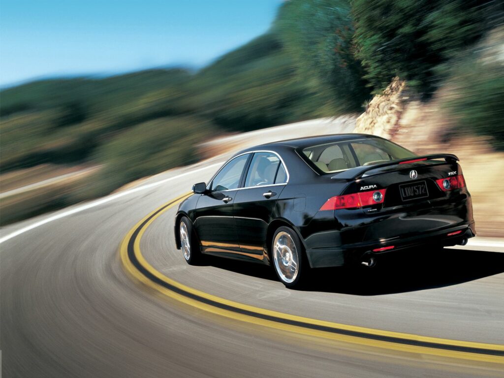 Sleek Black 2006 Acura TSX on Winding Road – Nature Background Wallpaper