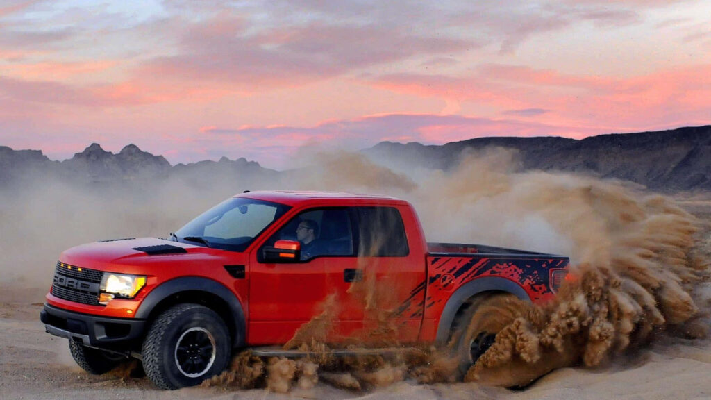 Stunning Red 2019 Ford F-150 Raptor Desert Wallpaper at Sunset