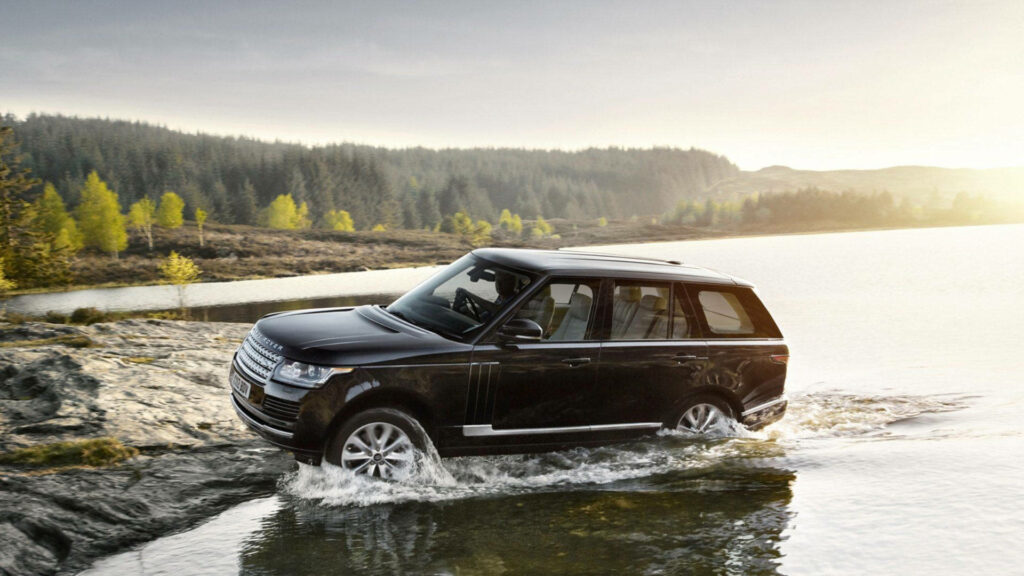 Adventure Wallpaper: Black Land Rover in Serene Lake & Forest
