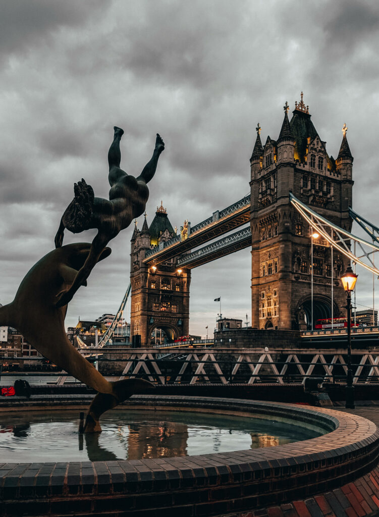 Striking Fountain Wallpaper with Tower Bridge & Dramatic Sky Backdrop