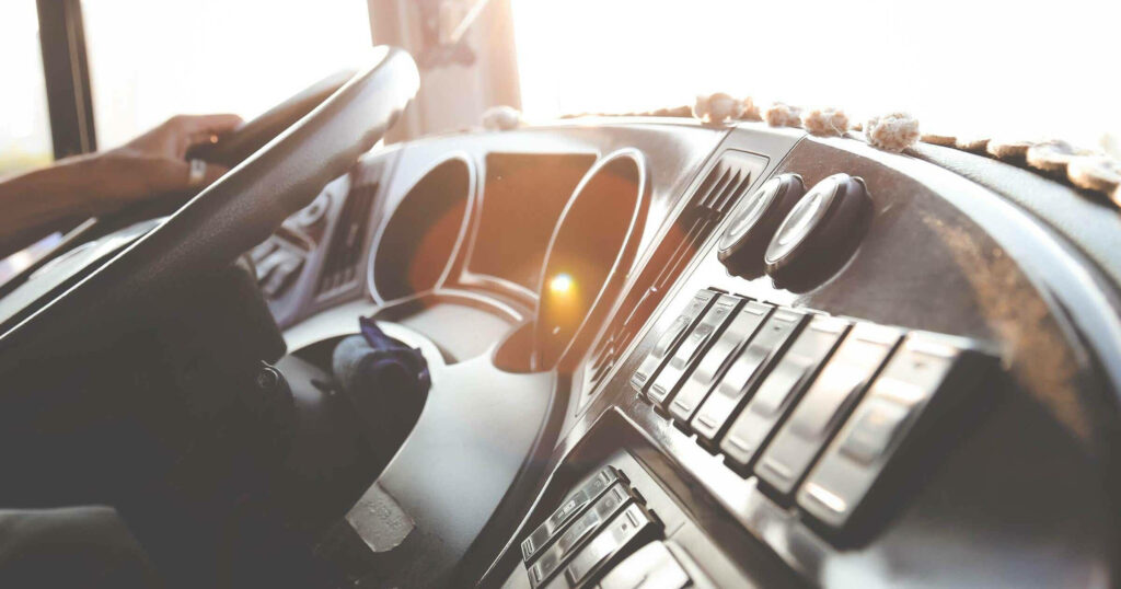 High-Tech Vehicle Interior Control Panel Wallpaper in Warm Sunlight