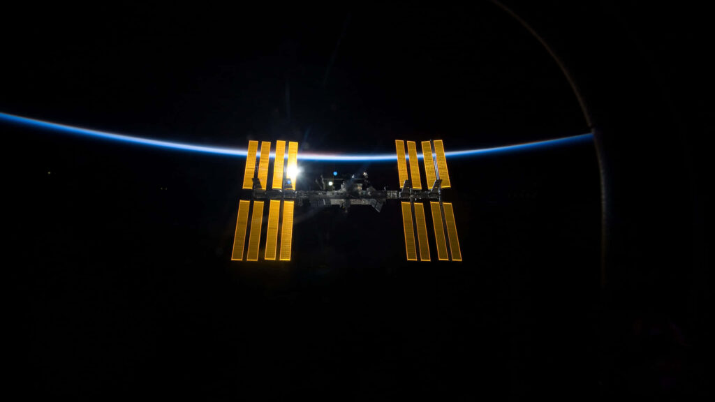 Stunning International Space Station Wallpaper: Earth & Sunlit Beauty