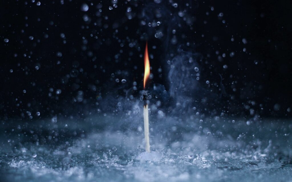 Stunning Fire and Water Contrast: Matchstick and Droplets Wallpaper