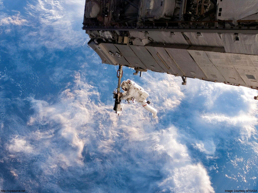NASA Astronaut Robert Curbeam Spacewalk Wallpaper with Earth View