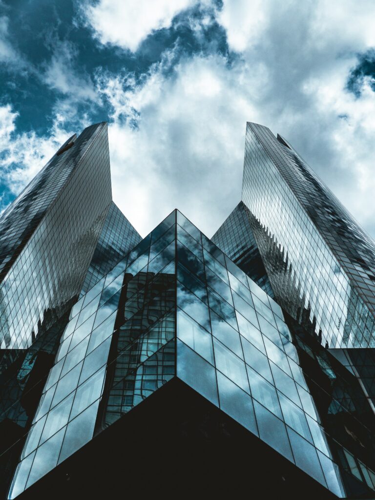 Stunning Bottom-Up View of Modern Glass Buildings - Wallpaper Background