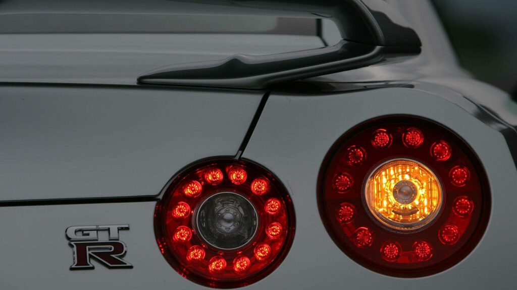 Stunning Nissan GT-R Wallpaper: Close-Up of Taillights & Logo