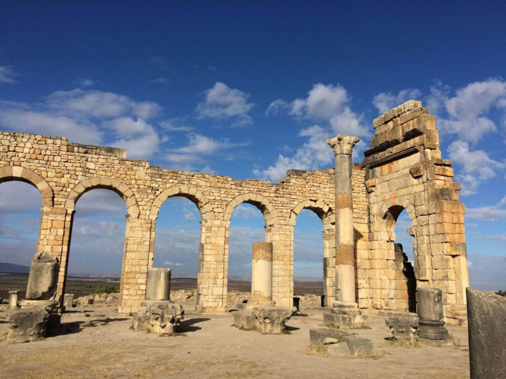 Roman Architecture Wallpaper: Volubilis Stone Structures and Arches