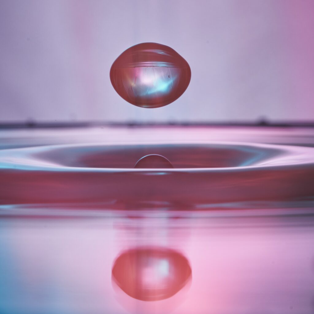 Stunning Macro Water Drop in Pink & Blue - Vibrant Wallpaper