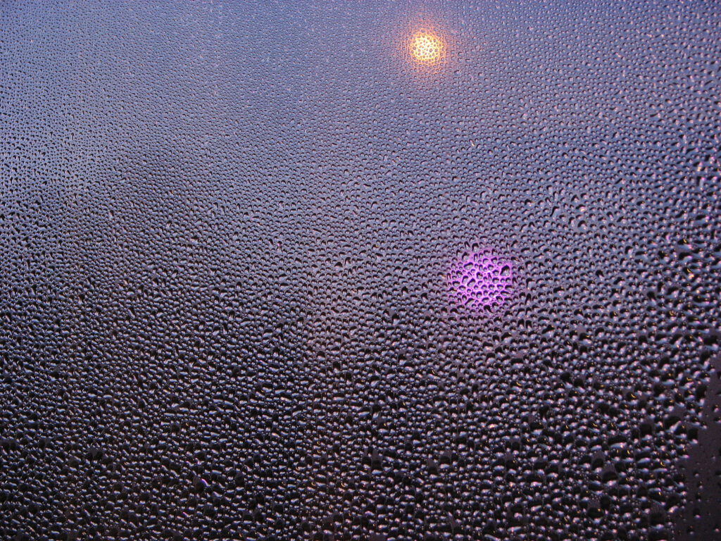 Shimmering Water Droplets on Glass - Macro Wallpaper Background
