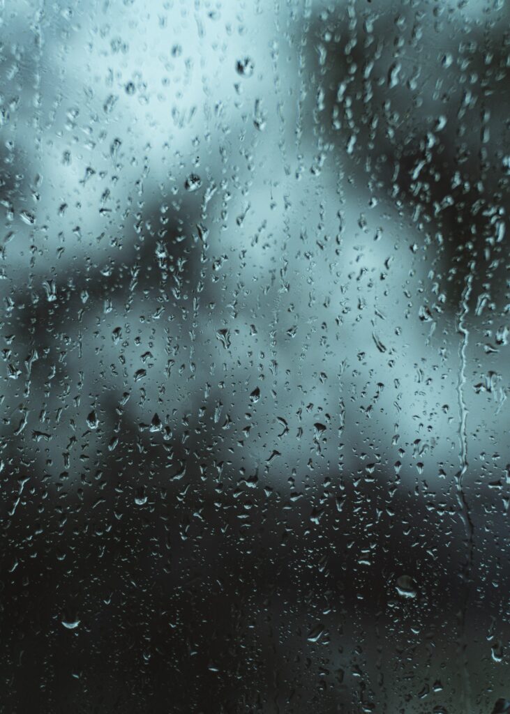 Close-Up Water Droplets on Glass - Blurred Wallpaper Background