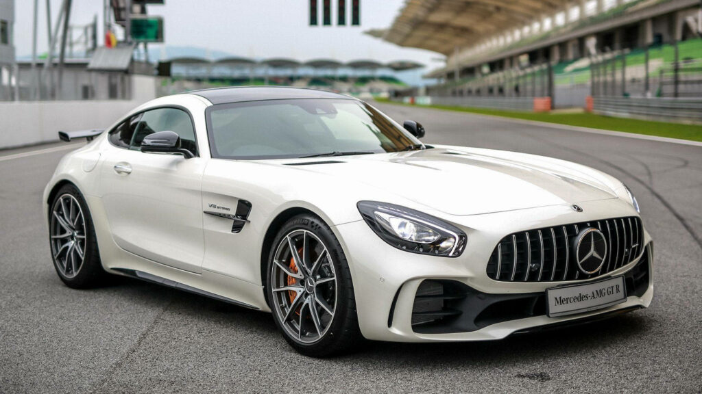 White 2017 Mercedes AMG GT R on racetrack sleek design high performance aerodynamic sports car Wallpaper