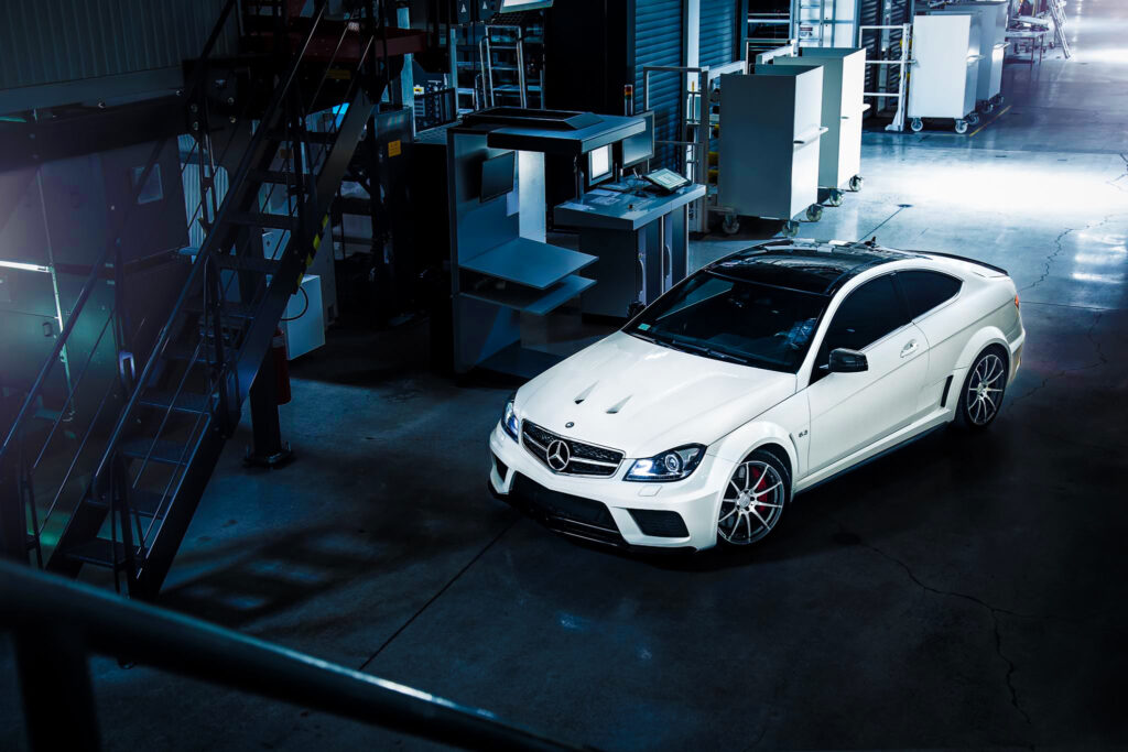 Stunning White Mercedes-Benz C63 AMG Wallpaper with Industrial Background