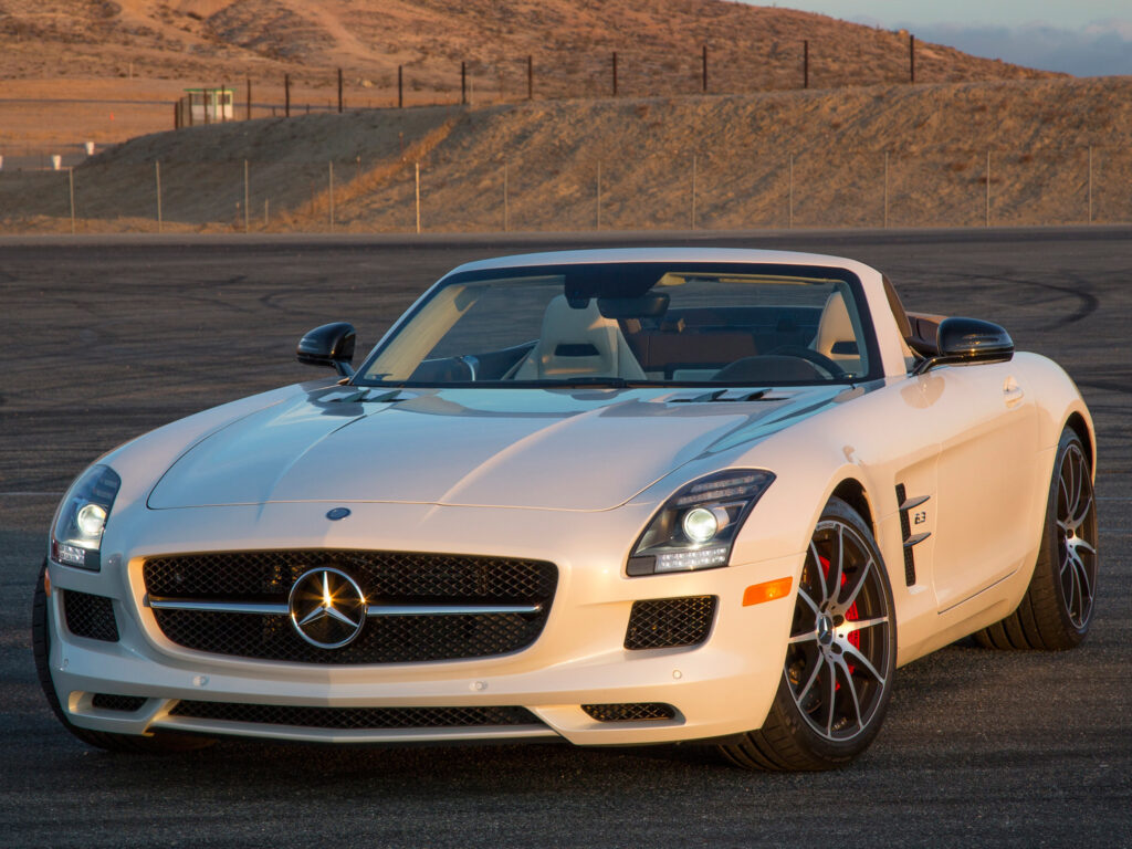 White Mercedes-Benz SLS AMG GT Convertible on Asphalt with Scenic Hills Wallpaper