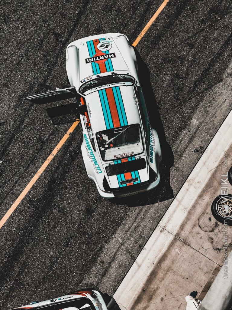 Stunning White Porsche 911 Wallpaper with Racing Stripes on Track