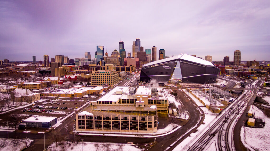 Stunning Winter Cityscape Wallpaper: Snowy Urban Charm & Stadium