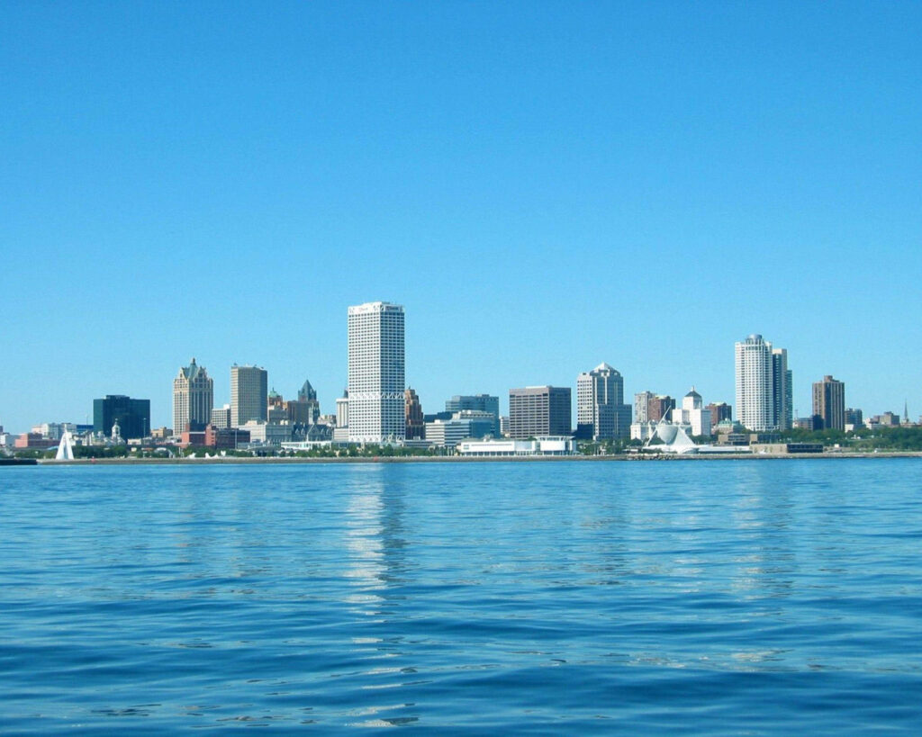 Serene Wisconsin River & Cityscape Reflection Wallpaper Background
