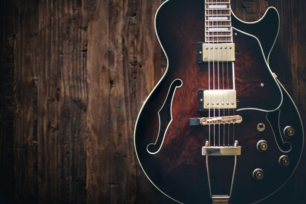 Beautiful Wooden Guitar Wallpaper: Warm Musical Vibe Background