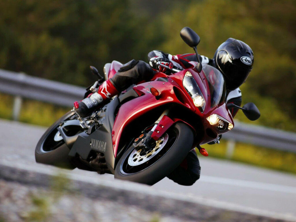 Thrilling Biker Cornering Sharp on Yamaha - Dynamic Wallpaper Background