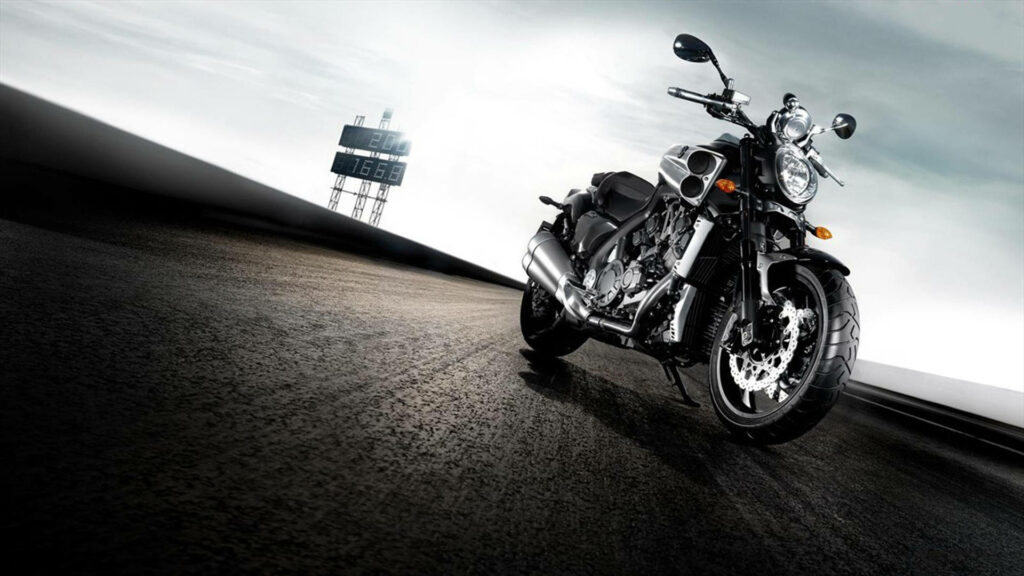 Stunning Yamaha VMAX HD Wallpaper: Sleek Black Bike on Racing Track
