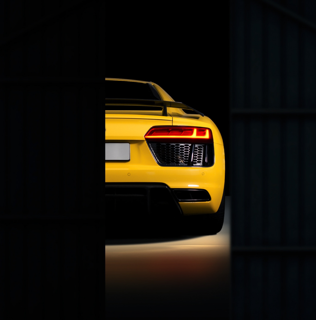 Stunning Yellow Audi R8 Rear View Wallpaper: Sleek Design & Mystery