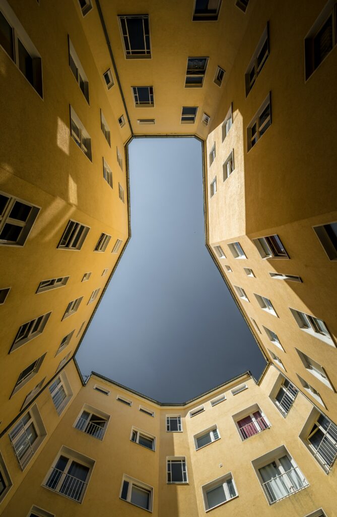 Stunning Yellow Building Wallpaper: Symmetrical Courtyard Design