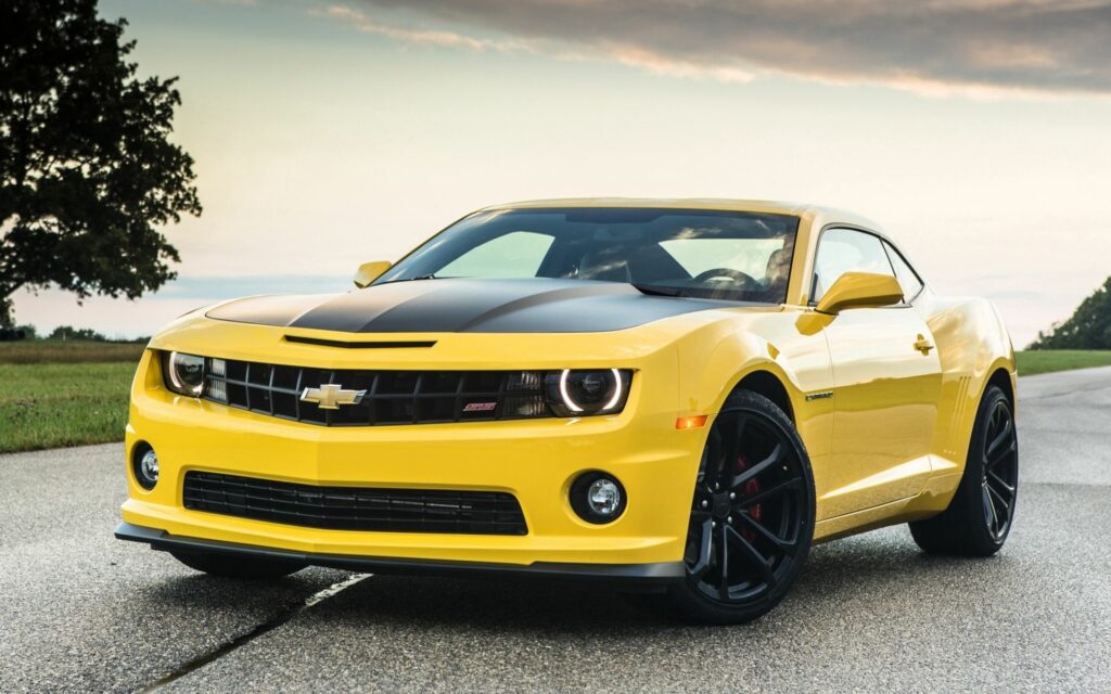 Bold Yellow Chevrolet Camaro 1LE Wallpaper: Dynamic Road Adventure