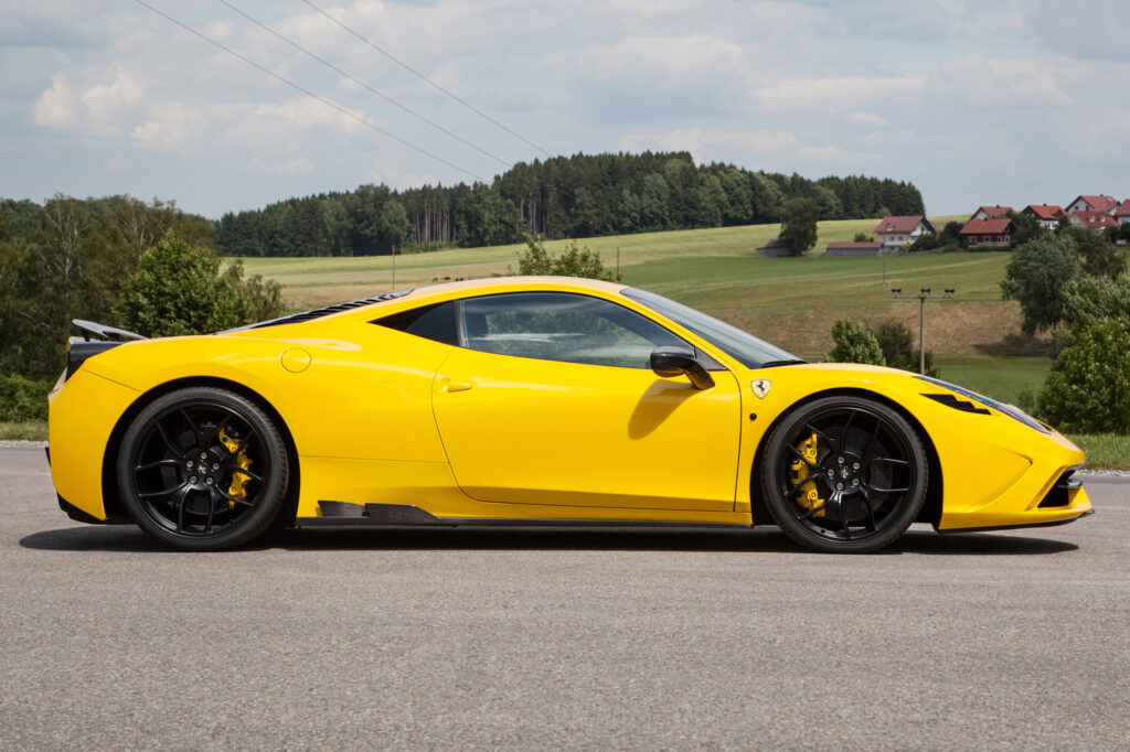 Stunning Yellow Ferrari 458 Speciale by Novitec Rosso in Scenic Setting Wallpaper