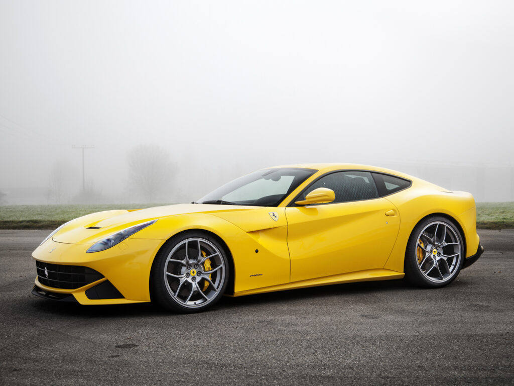Stunning Yellow Ferrari F12 Novitec Rosso Wallpaper with Misty Background
