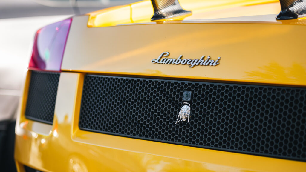 Striking Yellow Lamborghini Wallpaper: Luxury Design & Iconic Emblem