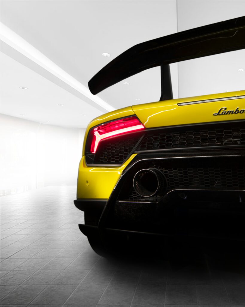 Stunning Yellow Lamborghini Rear View: Sleek Design & Tail Lights Wallpaper