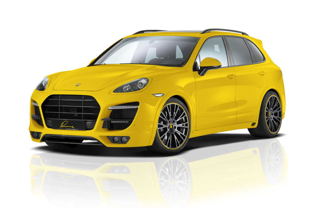 Stunning Yellow Porsche Cayenne with Lumma Design on White Background Wallpaper
