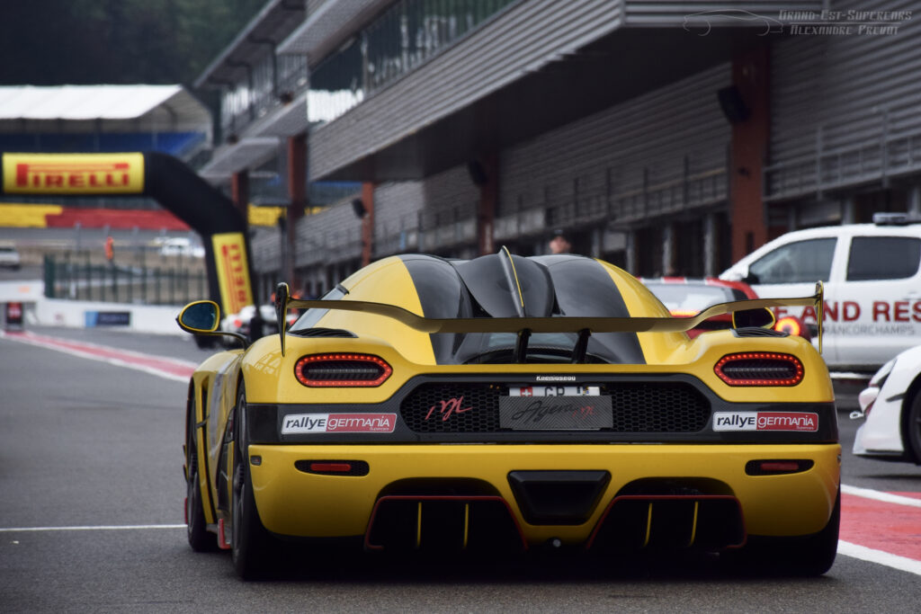 Stunning Yellow Sports Car in Rally - Dynamic Racetrack Wallpaper