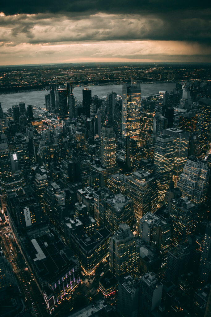 Stunning iPhone Wallpaper: Aerial Cityscape at Dusk with Dramatic Sky