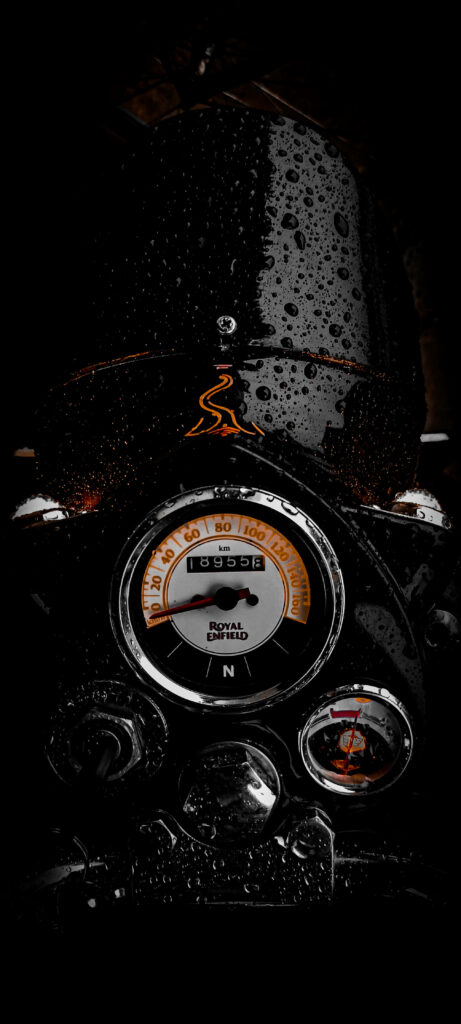 Stunning iPhone Wallpaper: Wet Royal Enfield Speedometer Close-Up