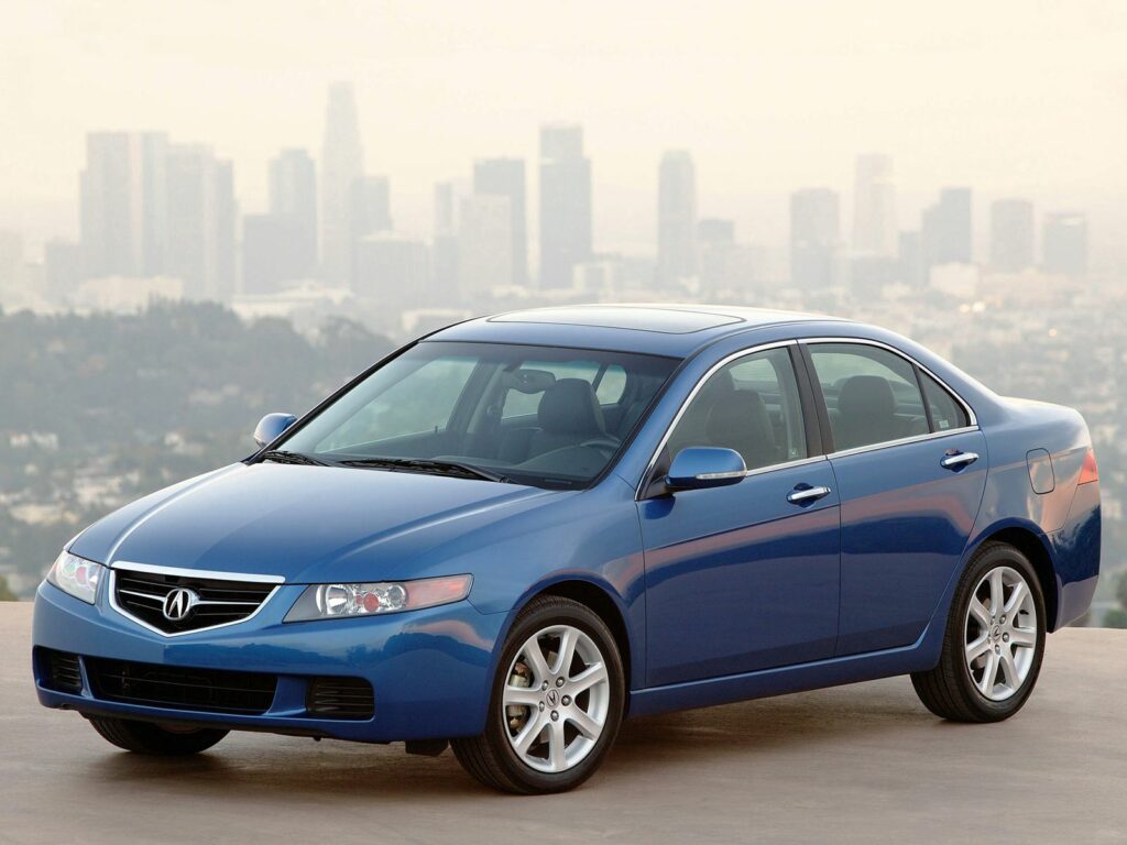 Stylish Blue 2003 Acura TSX Against City Skyline - Urban Wallpaper