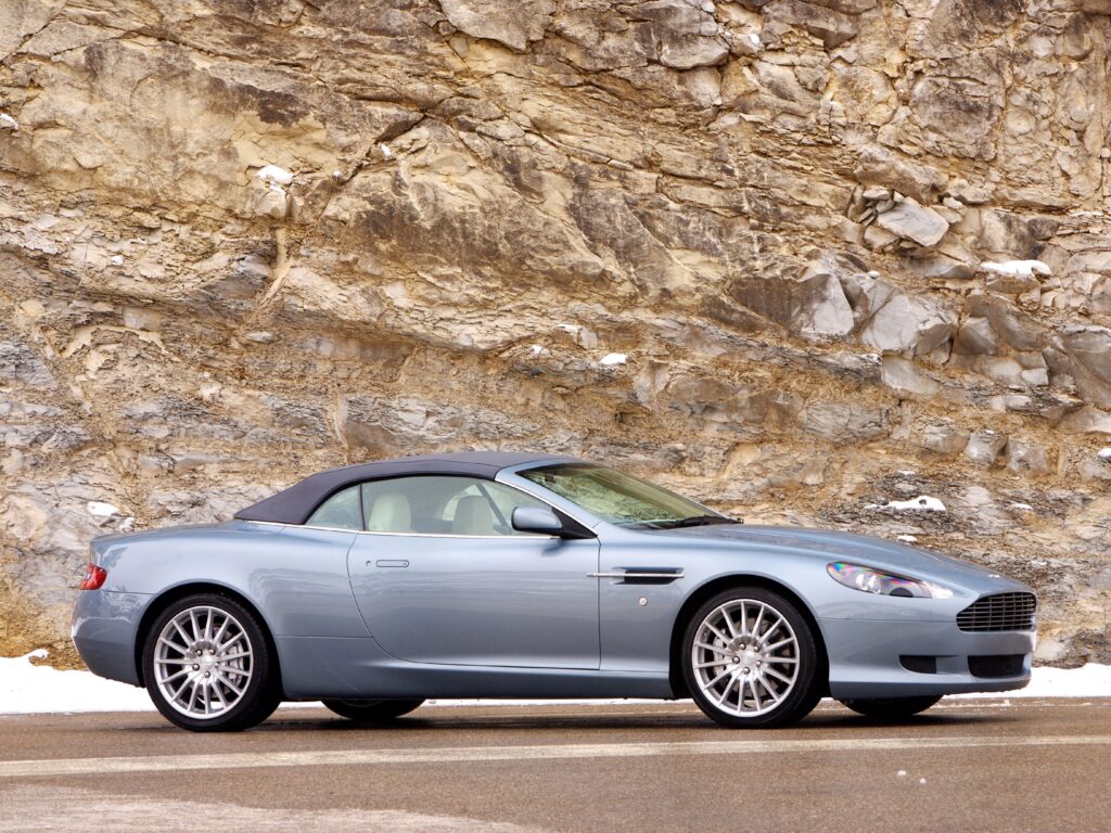 Elegant 2004 Aston Martin DB9 Wallpaper with Rocky Background