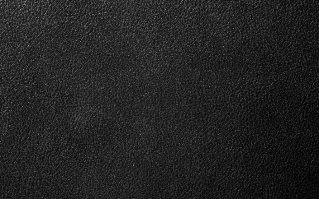 4K black leather wallpaper with detailed pebbled texture sleek minimalist chic noir background