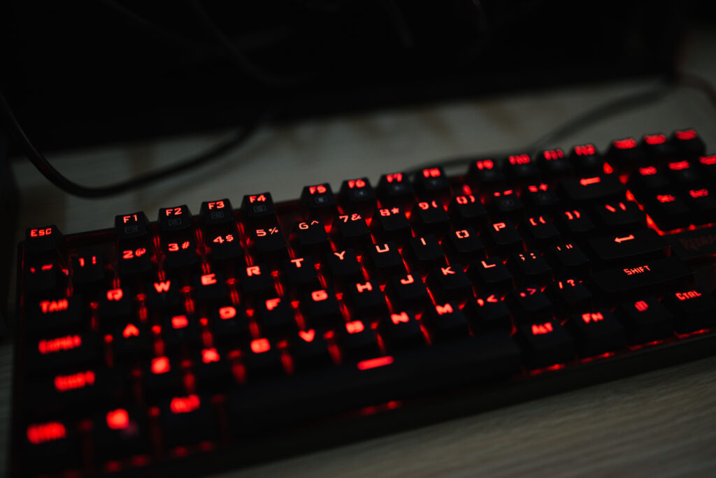 Vibrant Red Backlit Keyboard Wallpaper for Tech-Inspired Aesthetic
