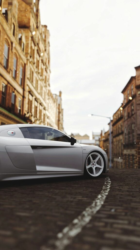 Sleek Audi R8 Side View Wallpaper: Elegance Meets Urban Performance