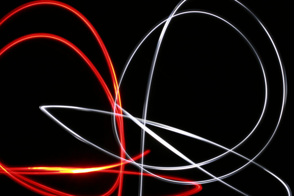 Dynamic Neon Lines Wallpaper: Sleek Black Background Design