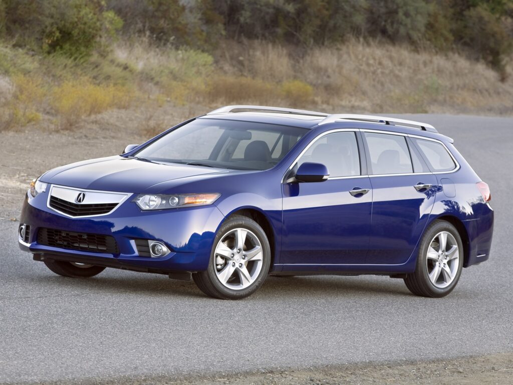Sleek Blue 2010 Acura TSX Side View Wallpaper on Asphalt Background