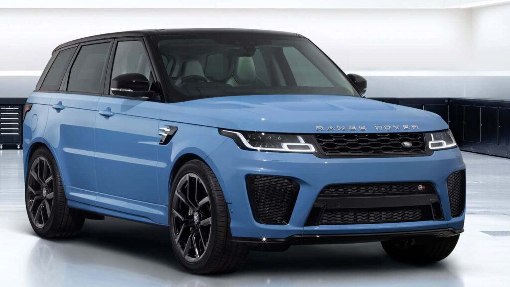 Stylish Blue Land Rover Range Rover Sport Wallpaper in Pristine Garage