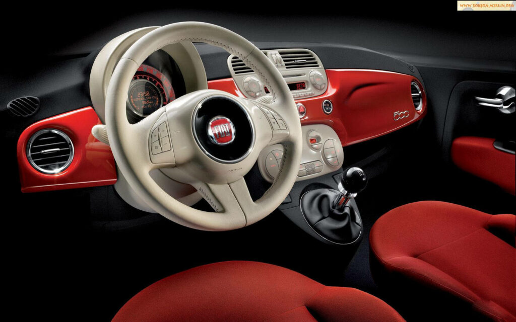 Stylish Fiat 500 Interior: Vibrant Red Accents Wallpaper Background