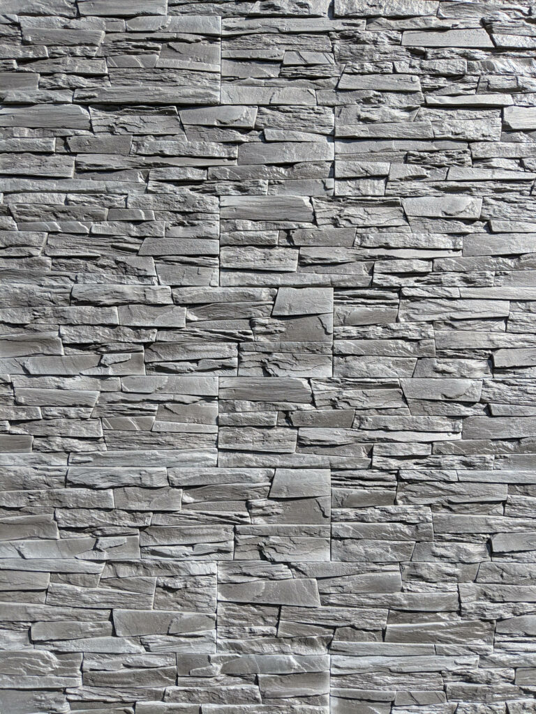 Stylish Grey Brick Wall Wallpaper: Textured Stone Design Background