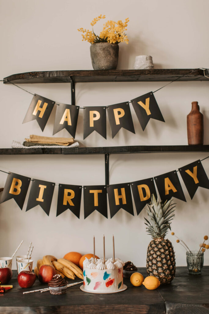 Elegant Happy Birthday Banner on Rustic Shelf: Festive Decor Background Wallpaper