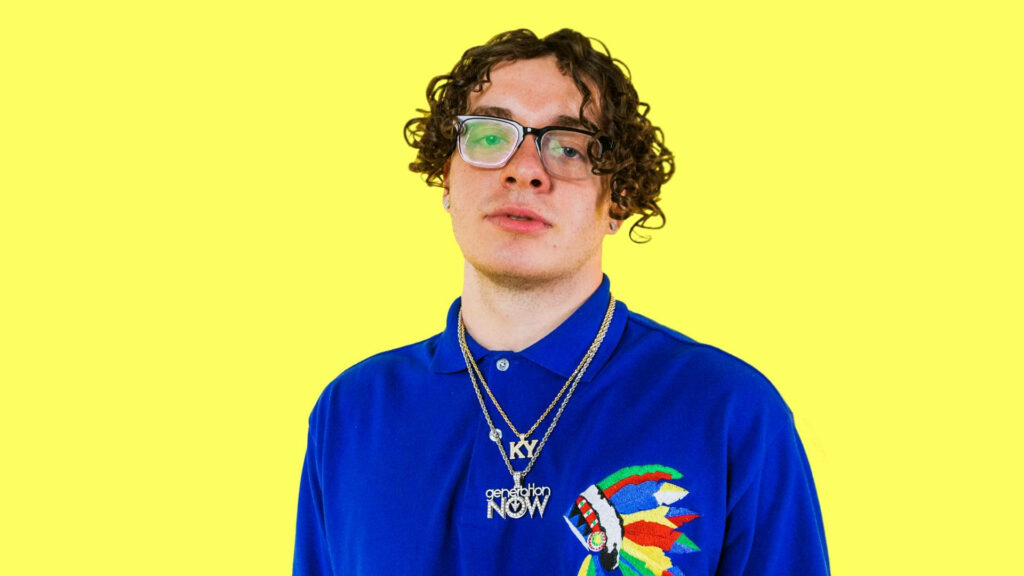 Jack Harlow's Stylish Wallpaper: Yellow Background & Blue Shirt Design